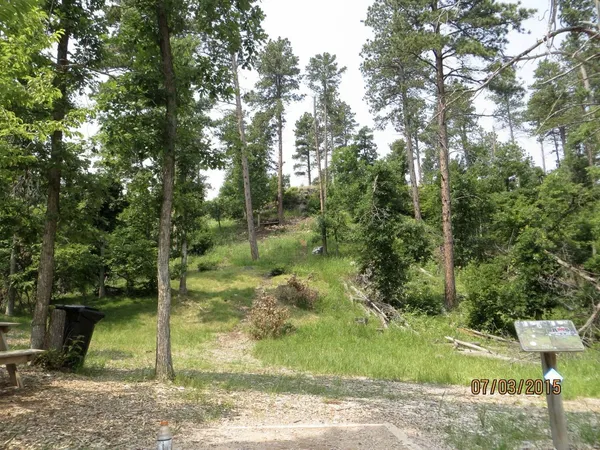 Spearfish Canyon DGC: Hole 6 · Tee pad · Jul 2015, photo by Vey Thach